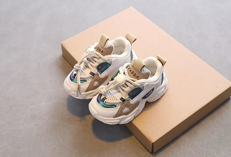Breathable Mesh Kids Casual Sneakers Non-Slip Sport Shoes for Boys and Girls in white and beige color on a brown box