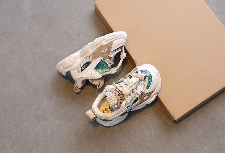 Breathable Mesh Kids Casual Sneakers Non-Slip Sport Shoes for Boys and Girls in white and teal with chunky soles beside a cardboard box